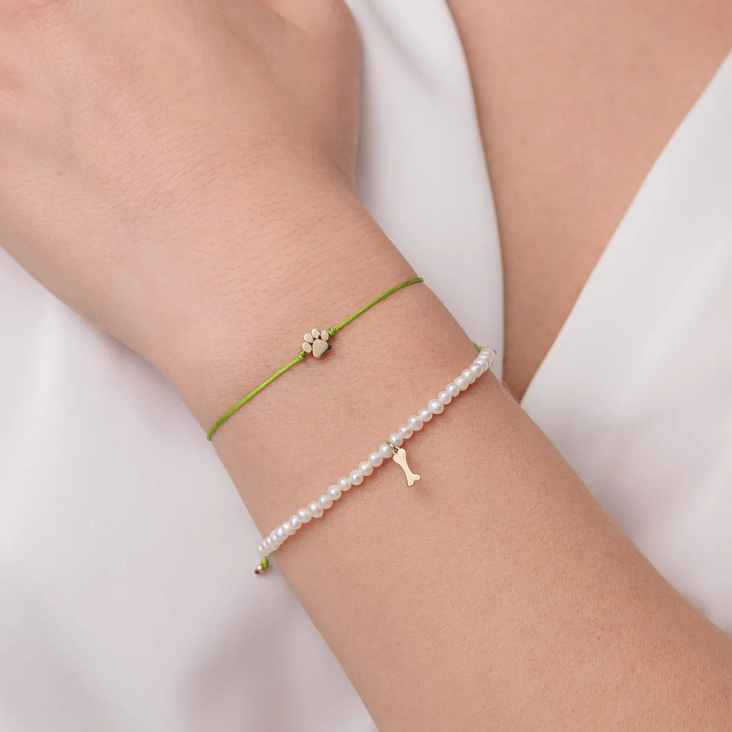 Pure Gold Tiny Dog Bone on Pearls