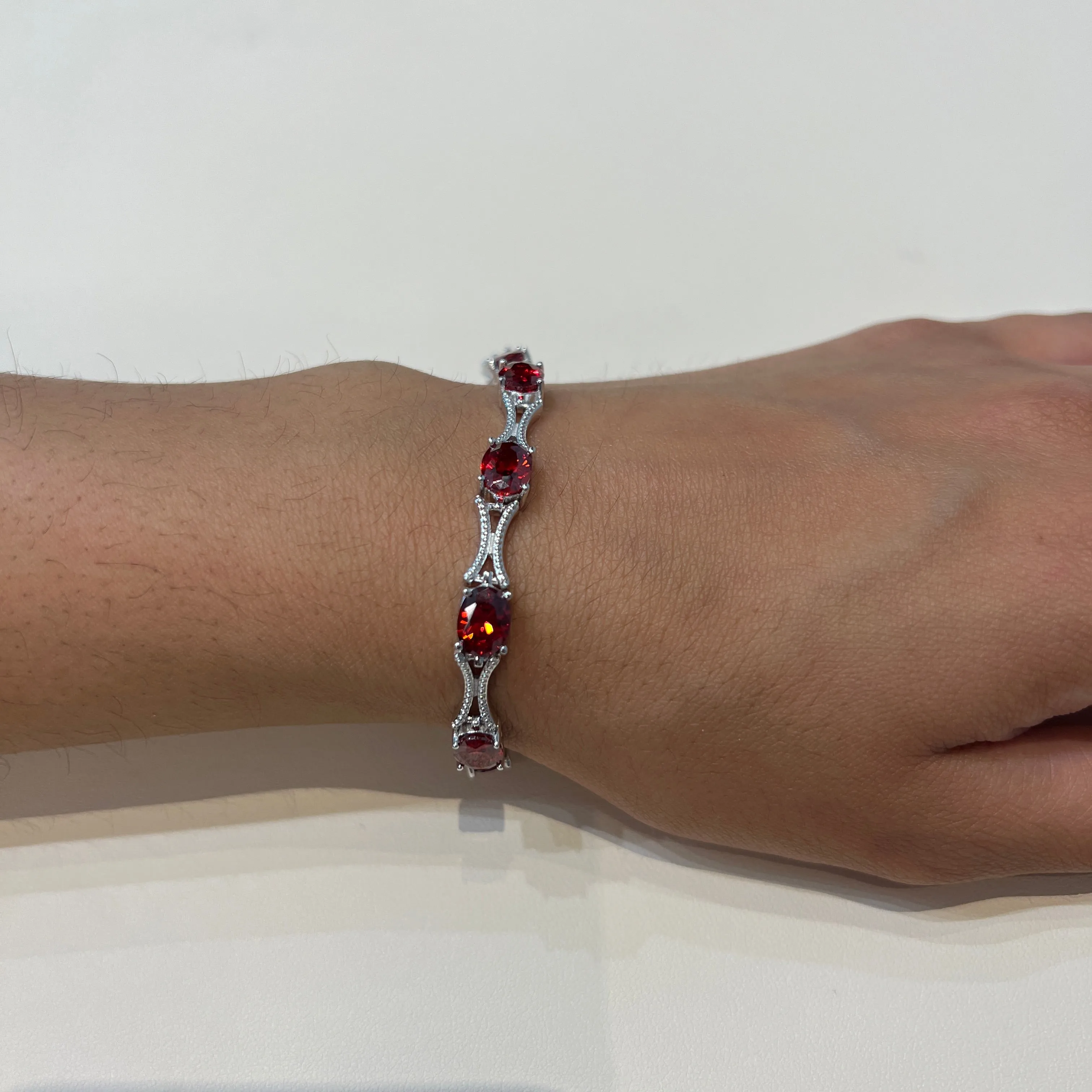 Sterling Silver Rhodium Plated Blue Oval CZ Tennis Bracelet