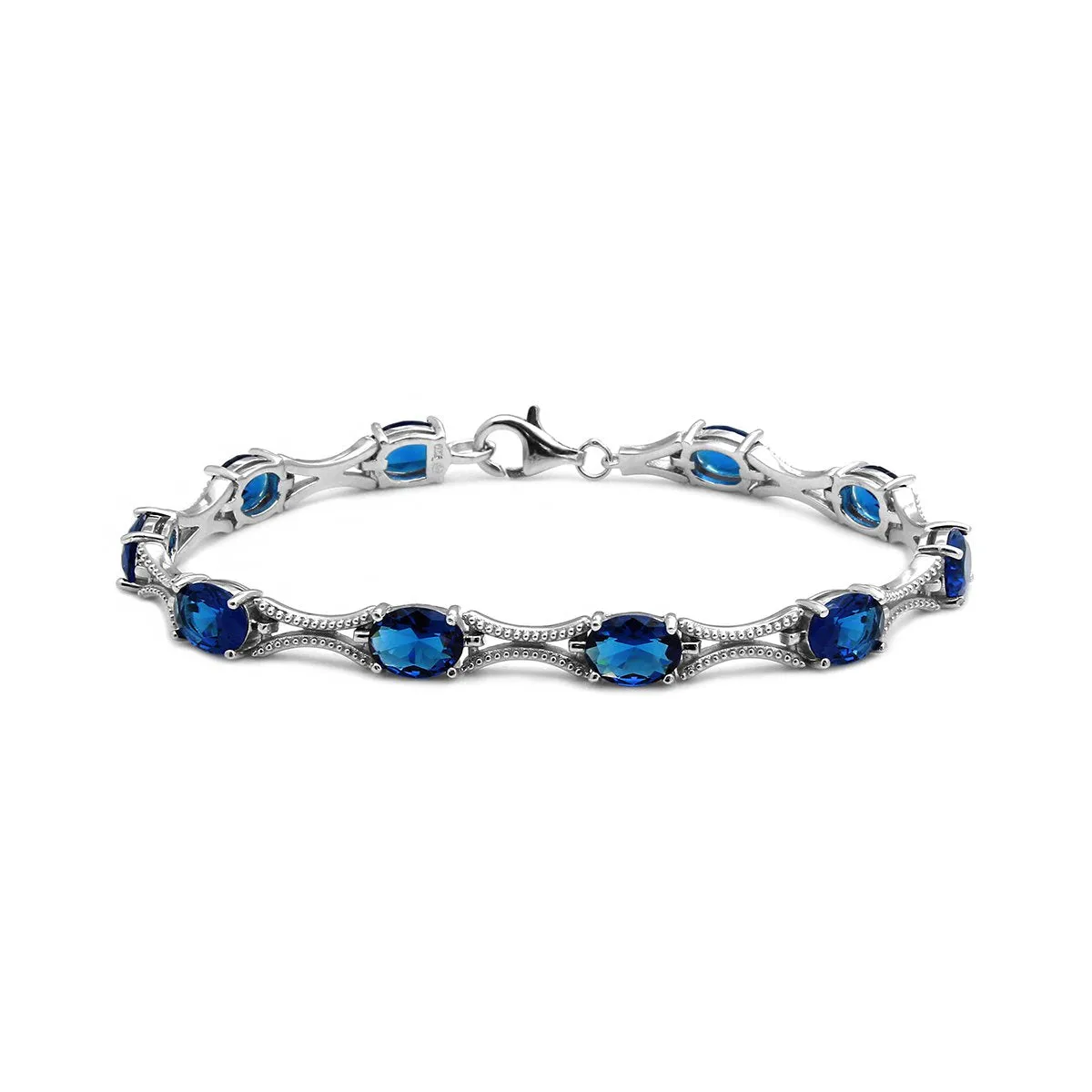 Sterling Silver Rhodium Plated Blue Oval CZ Tennis Bracelet