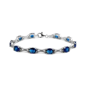 Sterling Silver Rhodium Plated Blue Oval CZ Tennis Bracelet